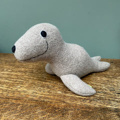 Wool Seal Soft toy on a table