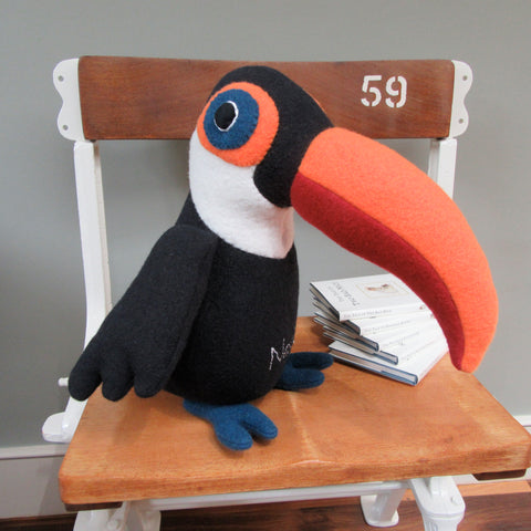 Toucan doorstop on a chair by cdbdi