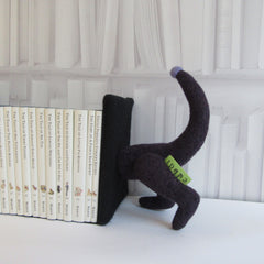 back end of dachshund bookends for children books in purple.