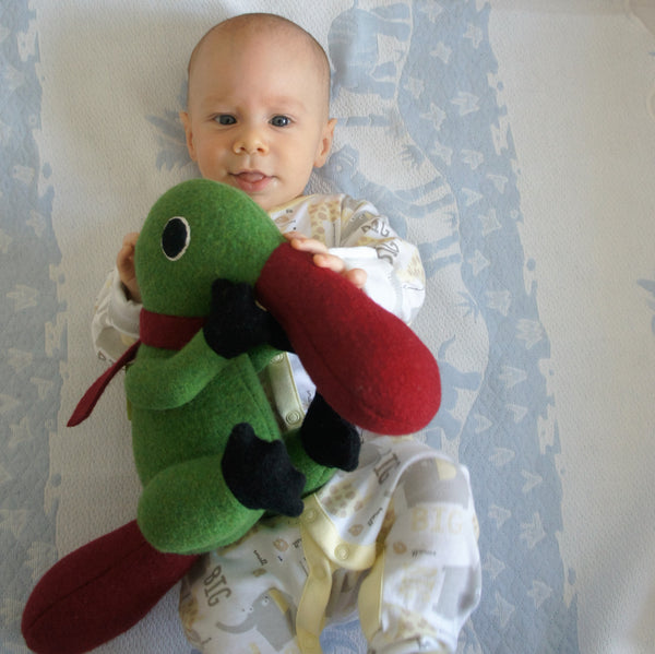 duck billed platypus in green and red with baby