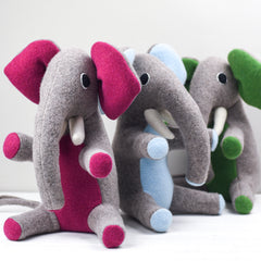 Medium sized elephants in green, pink and blue
